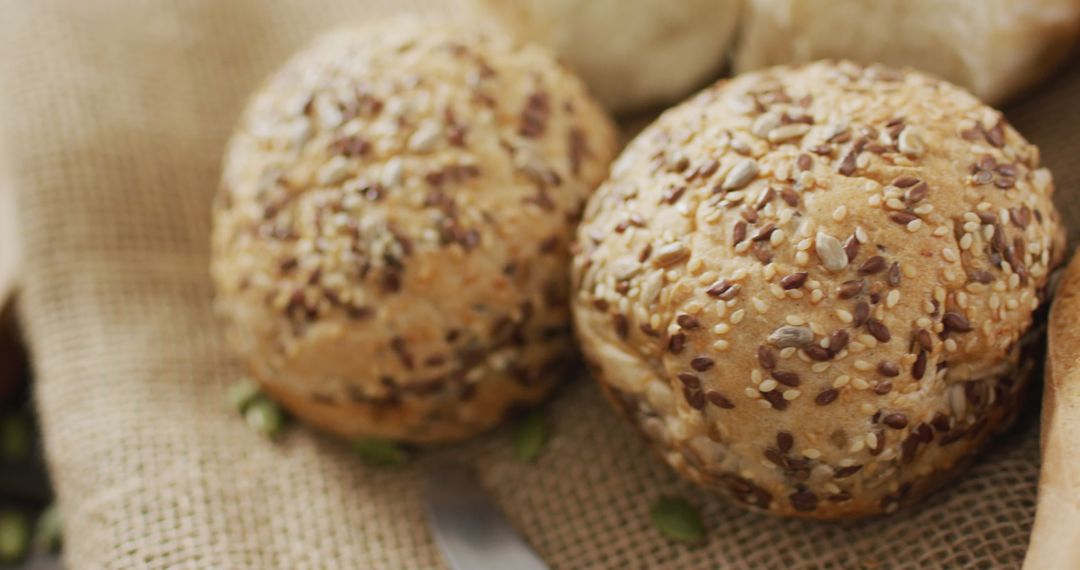 Rustic Whole Grain Bread Rolls on Burlap Cloth