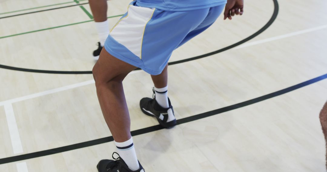 Basketball Players Running on Indoor Court - Free Images, Stock Photos and Pictures on Pikwizard.com