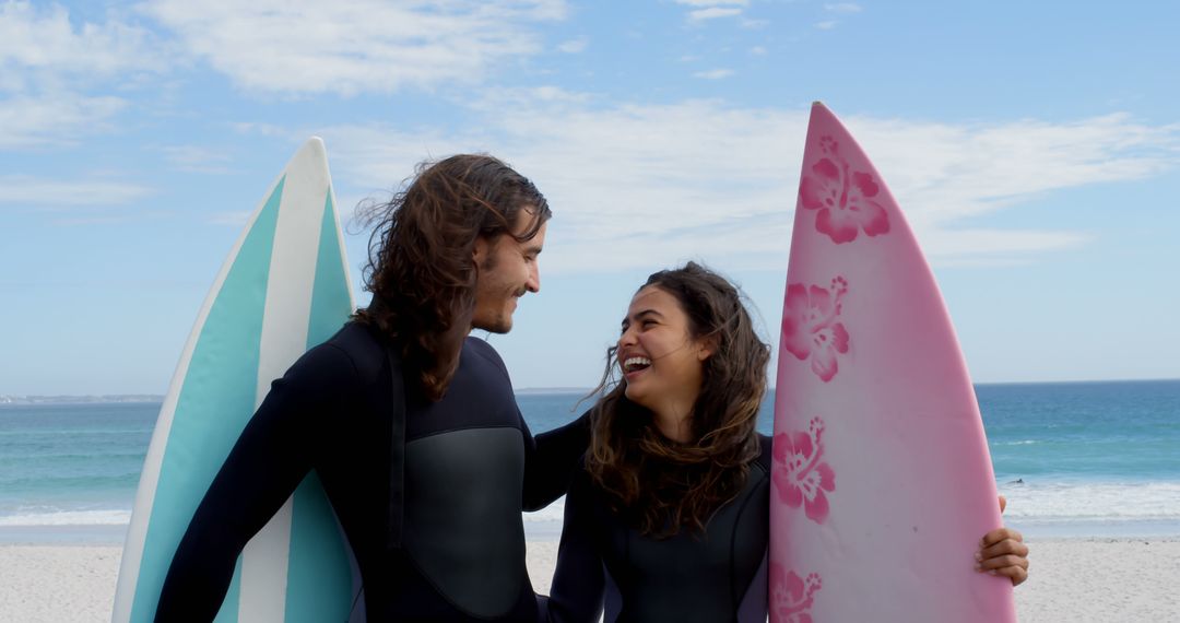 Young Couple Enjoying Surfing at the Beach - Free Images, Stock Photos and Pictures on Pikwizard.com