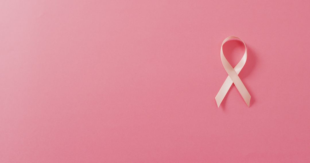 Image of pale pink breast cancer ribbon on pink background - Free Images, Stock Photos and Pictures on Pikwizard.com