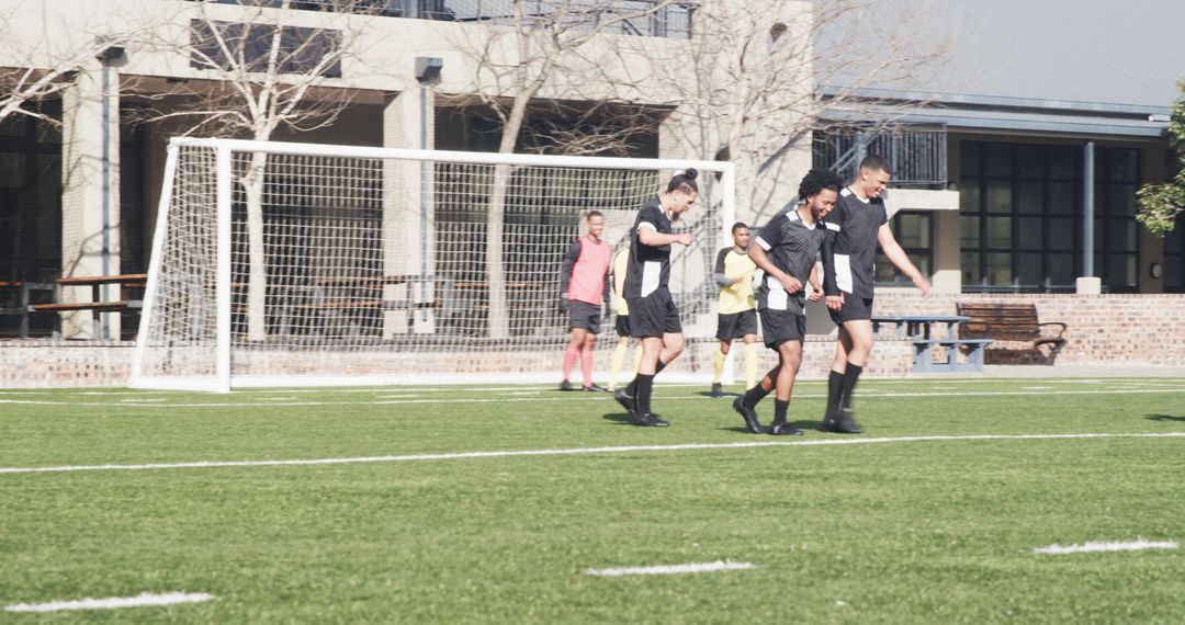 Soccer Players Exercising Teamwork and Skill Development