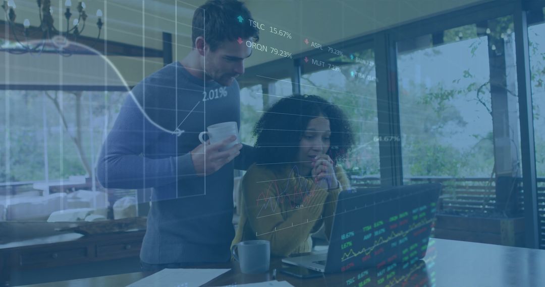 Diverse Team Analyzing Financial Data on Laptop Collaboration