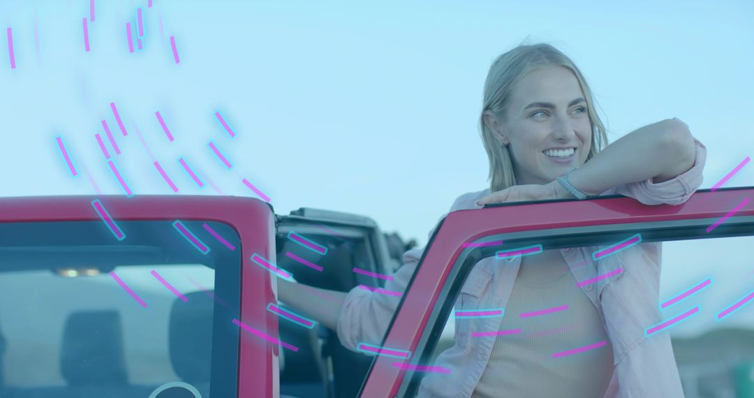 Smiling Woman Leaning on Red Convertible in Open Field, Joyful Adventure Vibe
