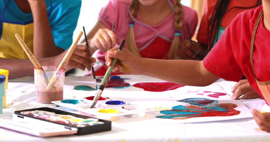 Children Painting Together at Arts and Crafts Table - Free Images, Stock Photos and Pictures on Pikwizard.com