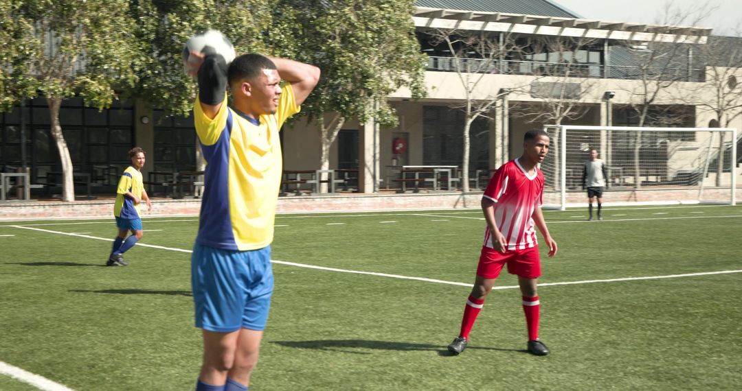 Young Soccer Players Competing Intensely on Busy Field