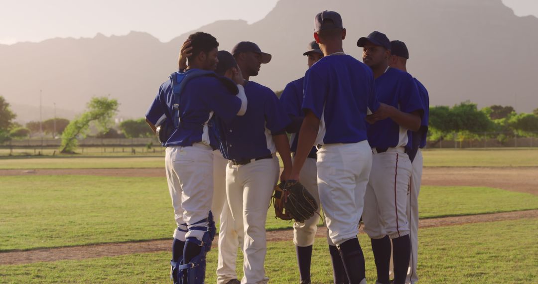 Baseball Team Huddle During Sunset on Field - Free Images, Stock Photos and Pictures on Pikwizard.com