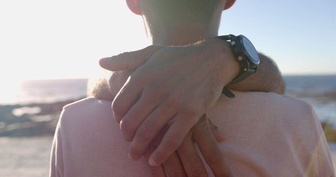 Close-Up of Couple Embracing by Beach at Sunset - Free Images, Stock Photos and Pictures on Pikwizard.com