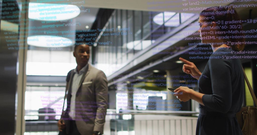 Colleagues Analyzing Program Code Display in Modern Workplace