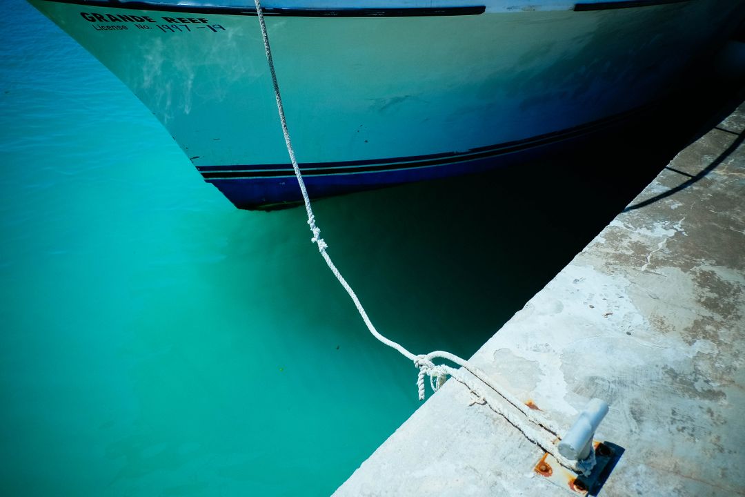 Bow of Boat Tethered to Dock in Crystal Blue Water - Free Images, Stock Photos and Pictures on Pikwizard.com