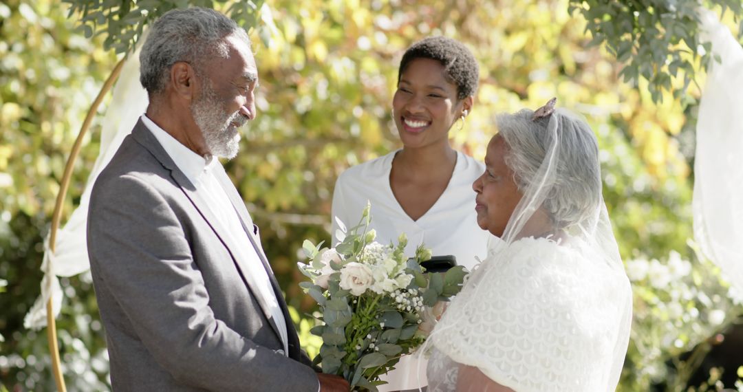 Elderly Couple Exchanging Vows in Outdoor Wedding Ceremony - Free Images, Stock Photos and Pictures on Pikwizard.com