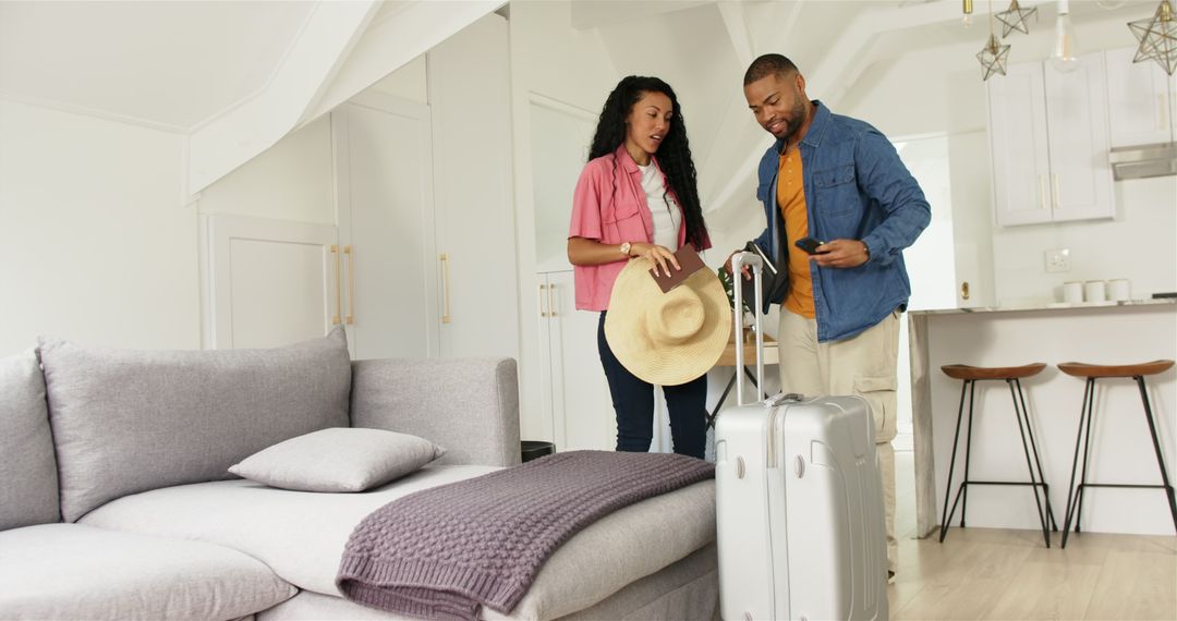 Couple Packing for Vacation with Suitcase at Home