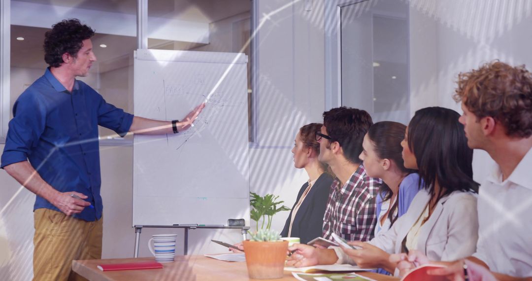 Diverse Team in Collaborative Meeting with Flipchart Presentation