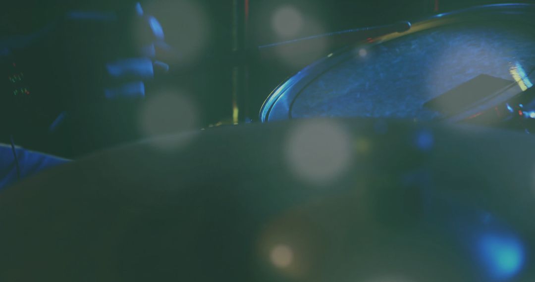 Snare Drum Close-Up with Drumstick Under Soft Stage Lighting