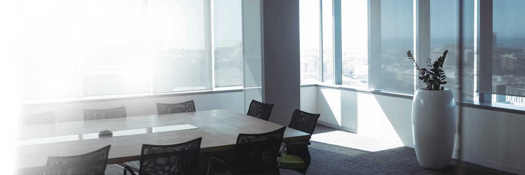 Transparent Modern Office Space with Large Table and Rolling Chairs