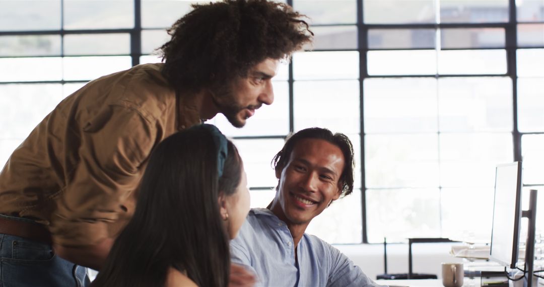 Diverse Team Collaborating in Sunlit Office Environment