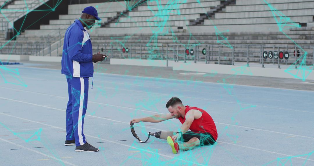 Athlete Adjusting Prosthetic on Track with Coach