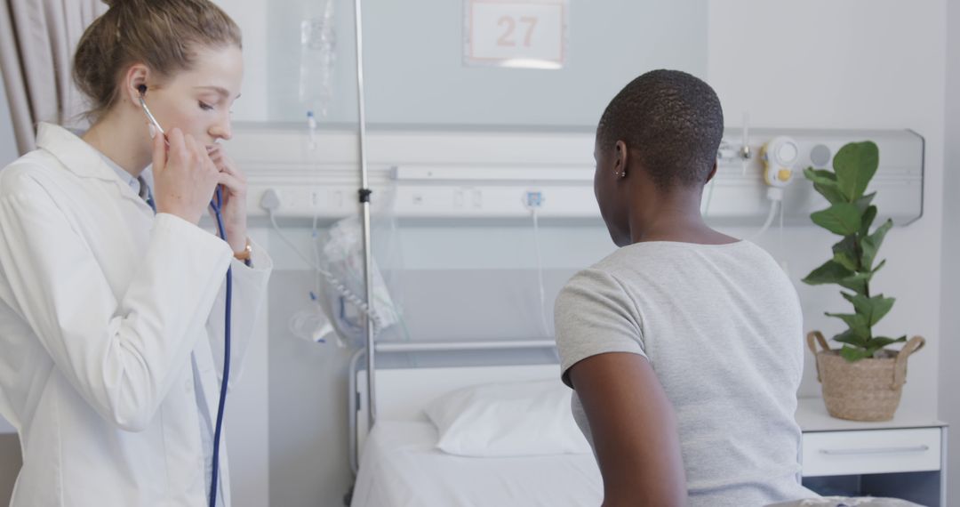 Doctor Checking Female Patient in Hospital Room - Free Images, Stock Photos and Pictures on Pikwizard.com