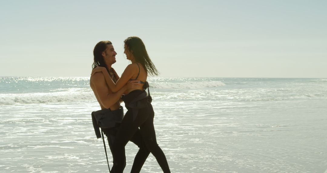 Caucasian couple enjoys a sunny beach day, with copy space - Free Images, Stock Photos and Pictures on Pikwizard.com