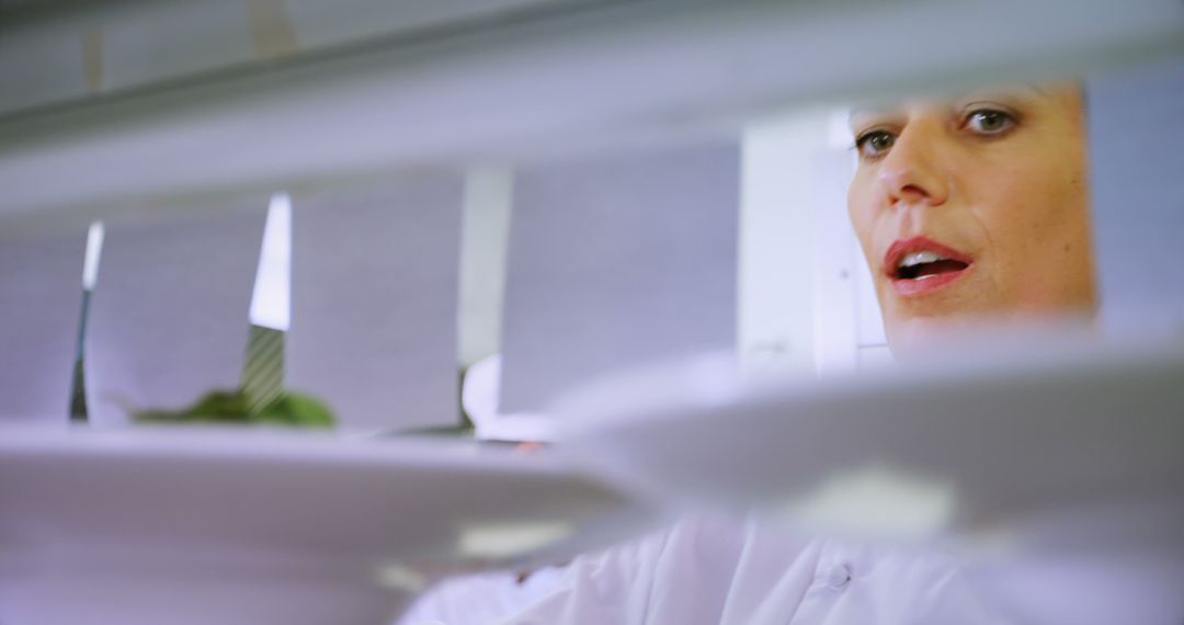 Focused Chef Concentrating on Dish Preparation in Professional Kitchen - Free Images, Stock Photos and Pictures on Pikwizard.com