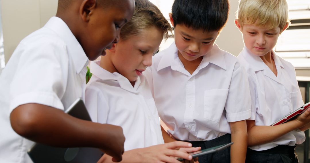 Diverse Group of Schoolboys Using Tablets in Classroom - Free Images, Stock Photos and Pictures on Pikwizard.com