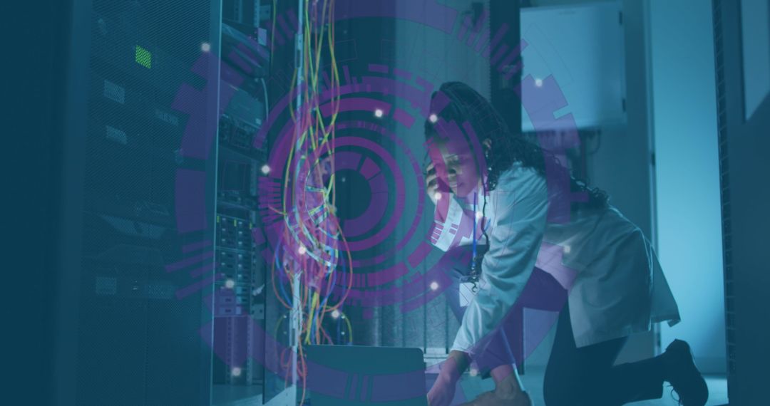 African American IT Specialist with Computer Servers and Digital Interface