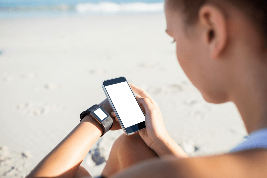 Person on Beach Using Transparent Smartphone and Latest Tech