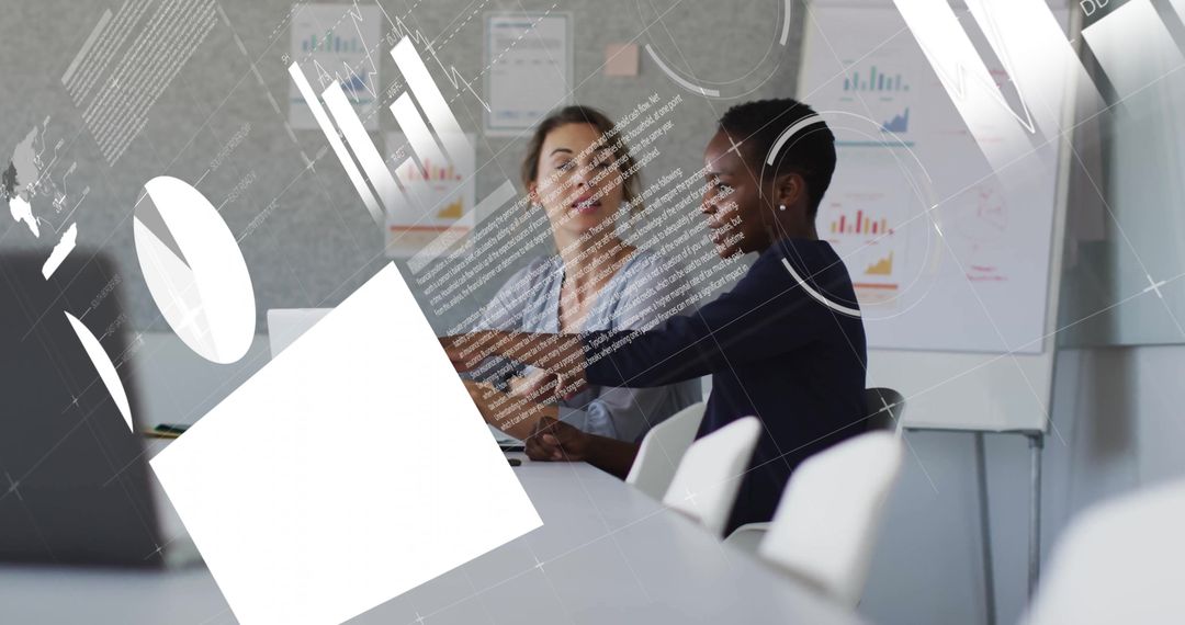 Colleagues Discussing Work Amidst Financial Data Visualizations