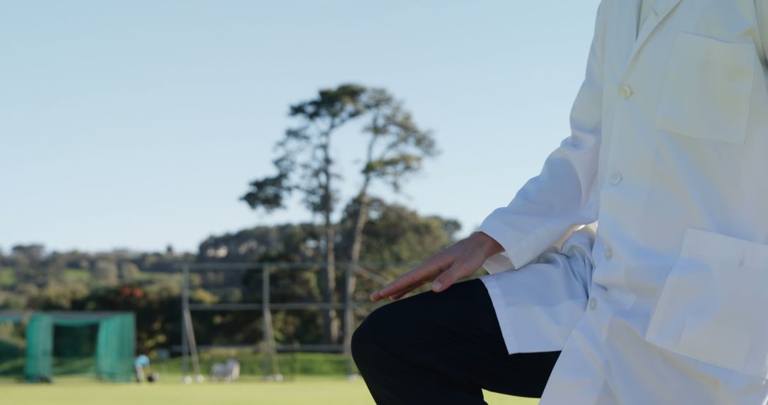 Medical Professional Standing on Outdoor Field with Trees - Free Images, Stock Photos and Pictures on Pikwizard.com