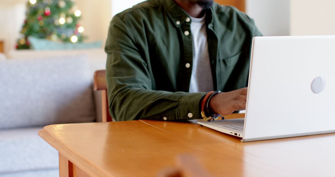 Working Remotely During Holidays by Christmas Tree