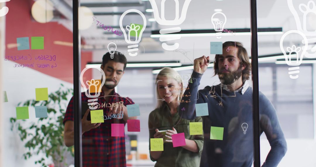 Creative Team Collaborating with Technology on Glass Wall