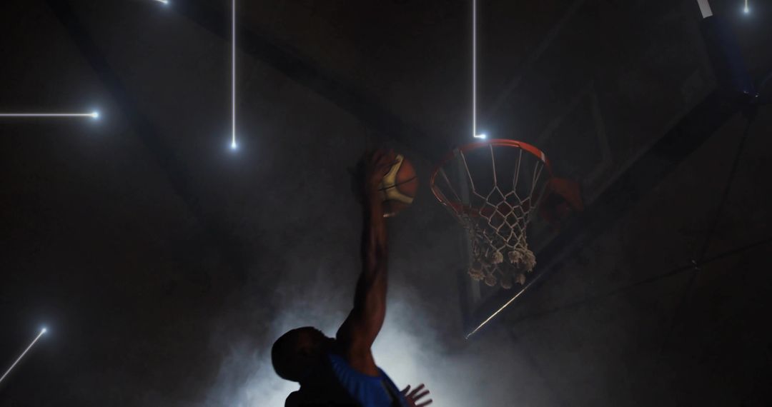 Basketball Player Enacting Powerful Slam Dunk with Dynamic Lighting