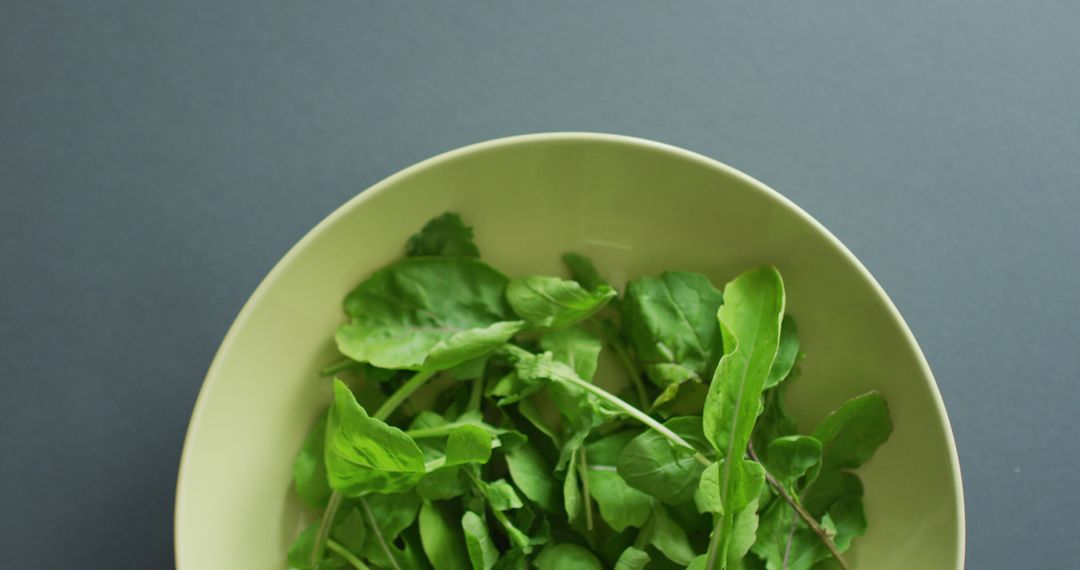 Fresh Green Spinach Leaves in Bowl on Gray Background - Free Images, Stock Photos and Pictures on Pikwizard.com