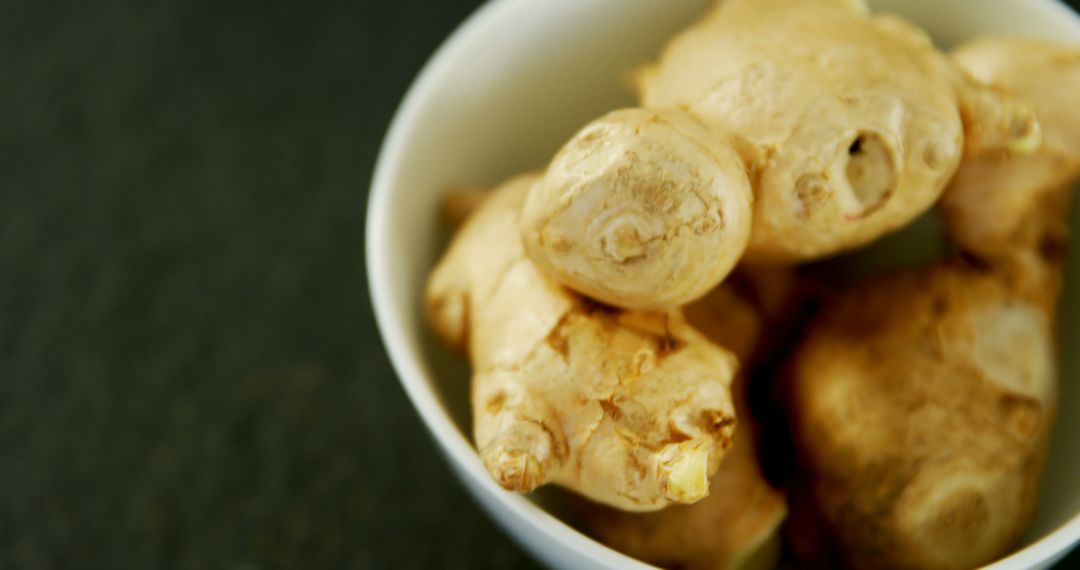 Fresh Ginger Roots in White Ceramic Bowl - Free Images, Stock Photos and Pictures on Pikwizard.com