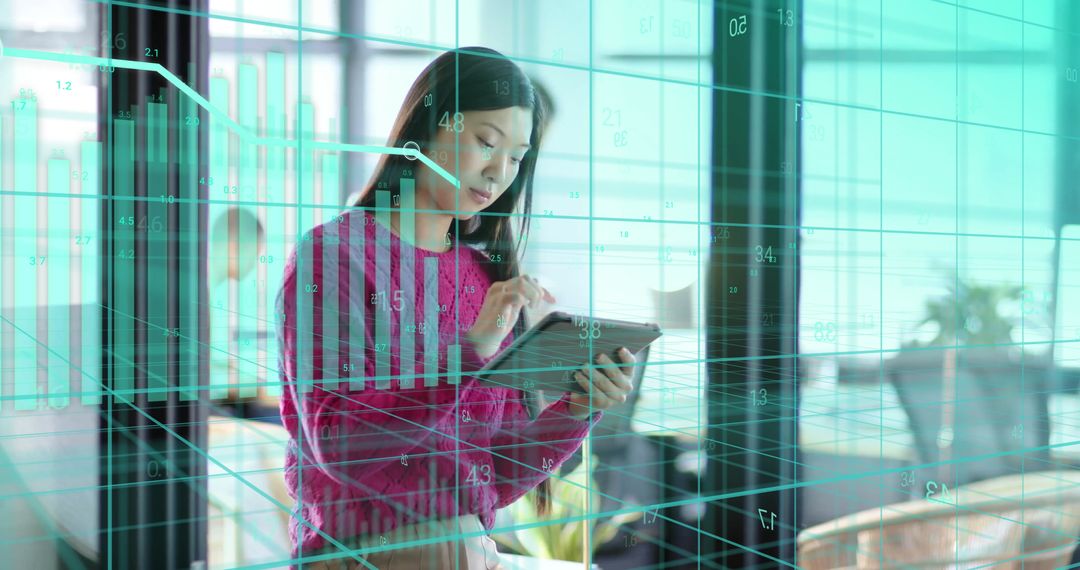 Businesswoman Analyzing Financial Data on Digital Tablet in Modern Office