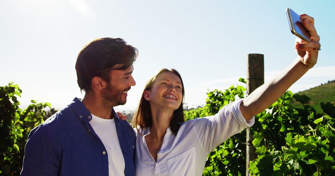 Couple Taking Selfie in Scenic Vineyard