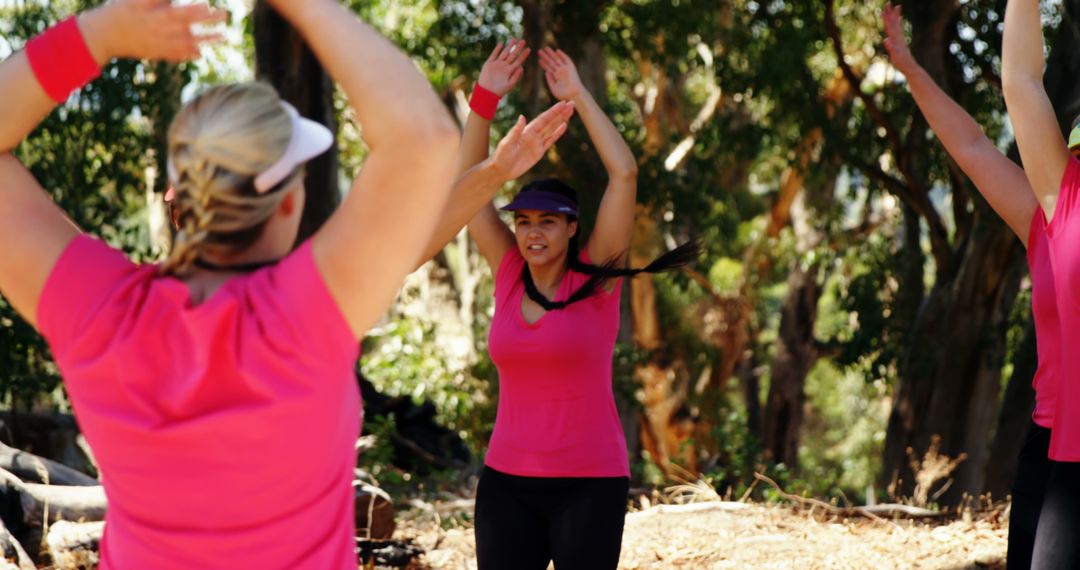 Group of Women Exercising Outdoors in Forest - Free Images, Stock Photos and Pictures on Pikwizard.com