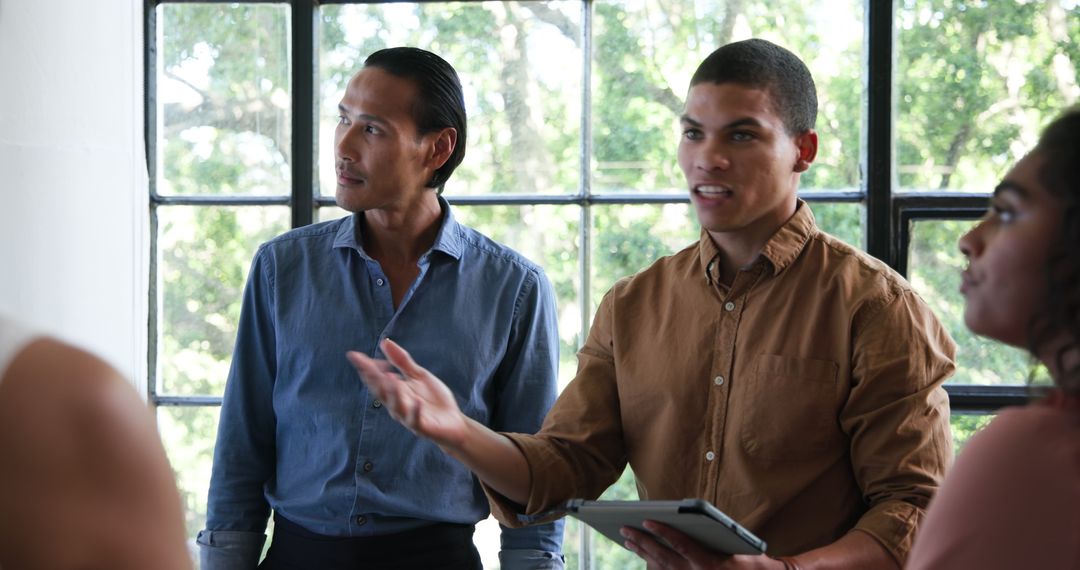 Diverse Team Engaged in Creative Brainstorming in Office Setting