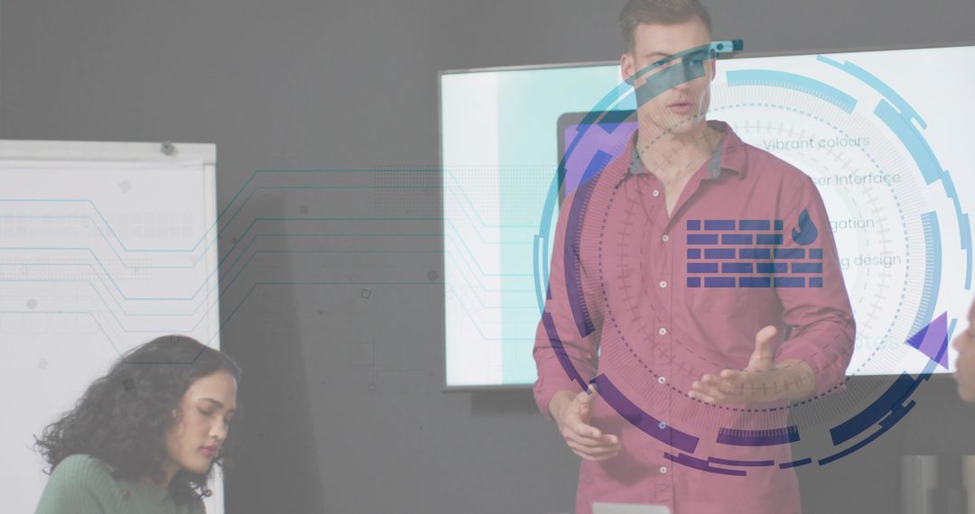 Presenter gesturing with digital HUD overlay while coworker taking notes in boardroom meeting