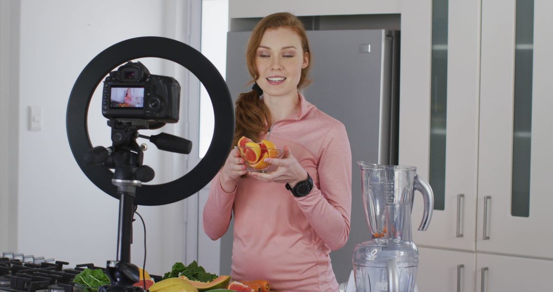 Woman Creating Healthy Food Vlog in Modern Kitchen - Free Images, Stock Photos and Pictures on Pikwizard.com