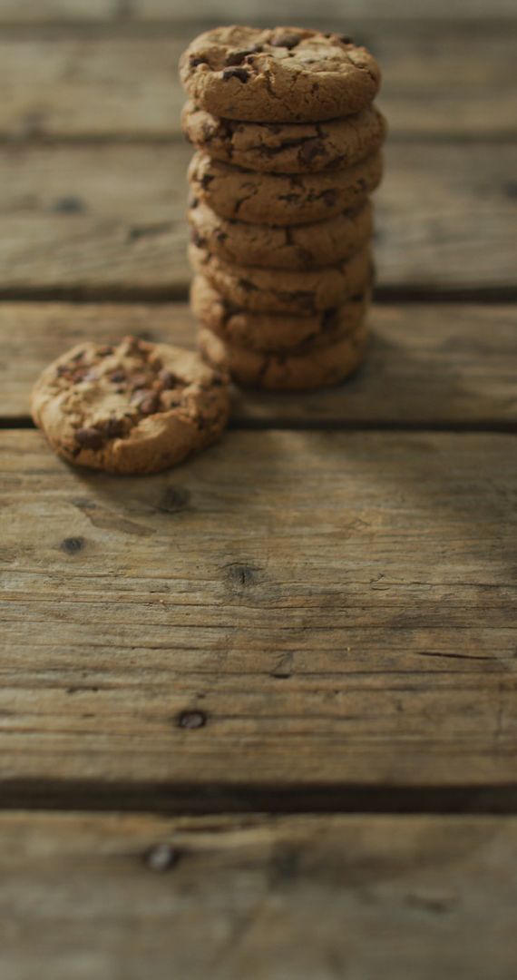 Stack of Delicious Chocolate Chip Cookies on Rustic Wooden Table - Free Images, Stock Photos and Pictures on Pikwizard.com