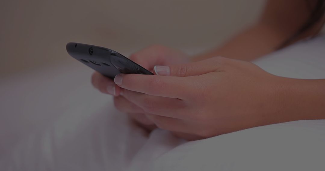 Caucasian Woman Browsing Smartphone at Home in Relaxed Setting