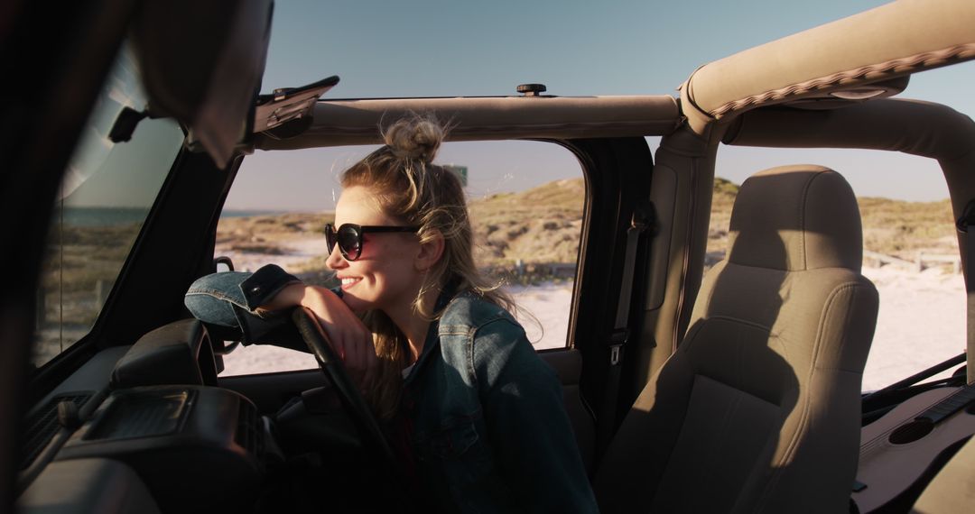 Woman Enjoying Coastal Road Trip in Convertible Jeep During Sunset - Free Images, Stock Photos and Pictures on Pikwizard.com