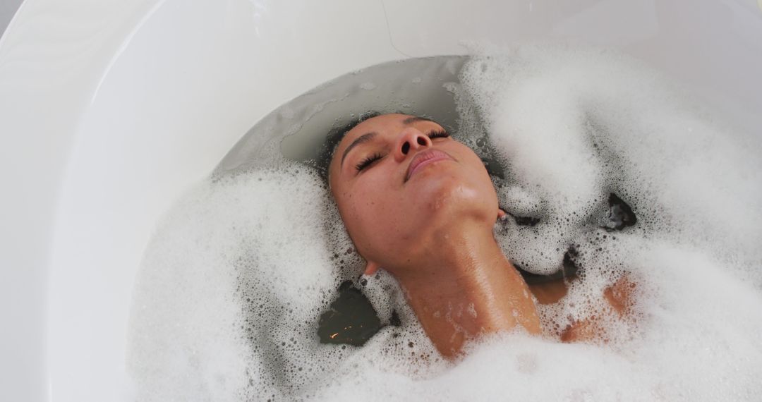 Woman Relaxing in Bubble Bath with Eyes Closed - Free Images, Stock Photos and Pictures on Pikwizard.com