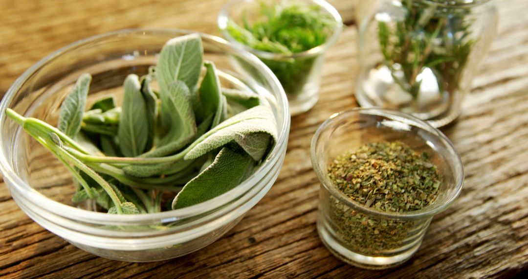 Various Fresh and Dried Herbs in Glass Bowls on Wooden Table - Free Images, Stock Photos and Pictures on Pikwizard.com