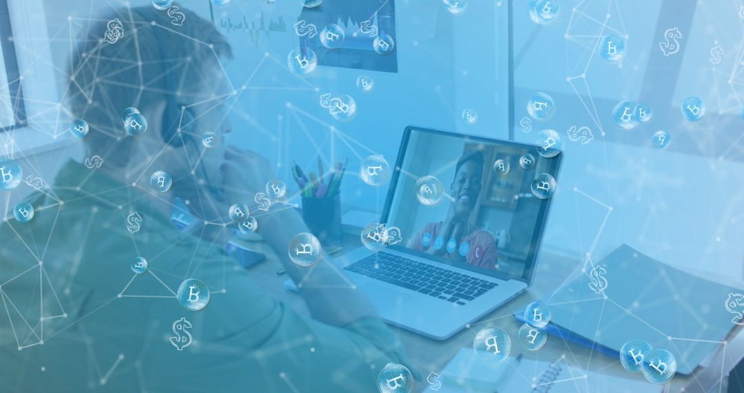 Businessman Using Laptop with Cryptocurrency Symbols