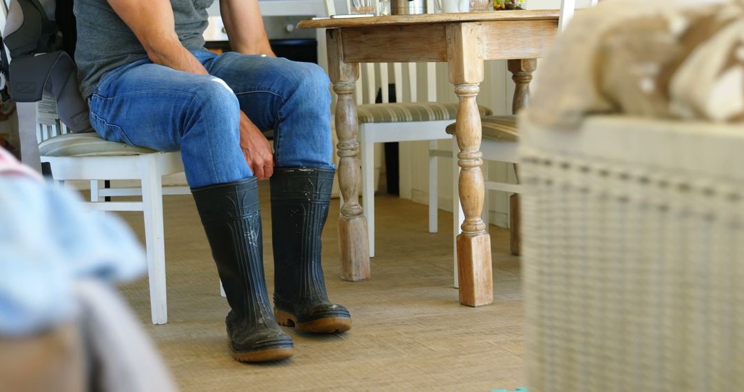 Person Wearing Rubber Boots Indoors in Home Environment - Free Images, Stock Photos and Pictures on Pikwizard.com