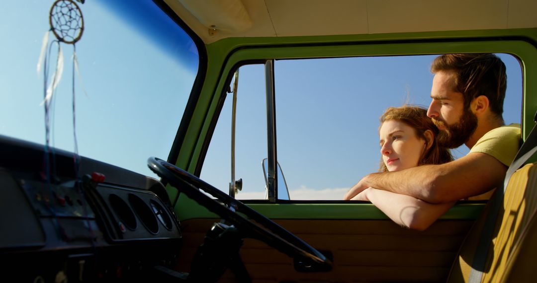 Couple Enjoys Sunset from Vintage Green Van Interior - Free Images, Stock Photos and Pictures on Pikwizard.com