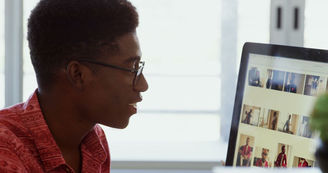 Creative Male Graphic Designer Working on Computer in Modern Office