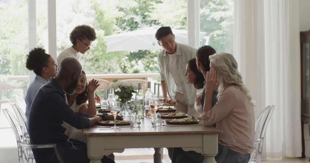 Diverse Group Enjoying Lunch, Celebrating Togetherness at Home
