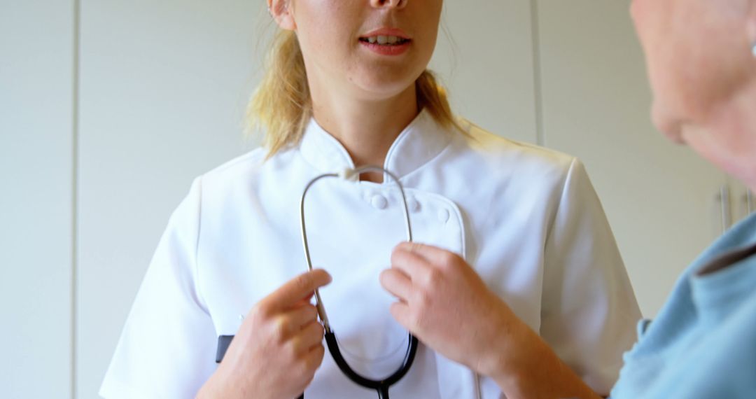 Female Nurse Preparing Stethoscope for Medical Exam - Free Images, Stock Photos and Pictures on Pikwizard.com